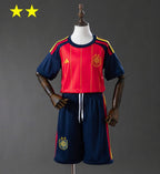 T-shirt e Pantaloncini Bambino Spagna Home 26/27 - Due volte Campione del Mondo ⭐⭐